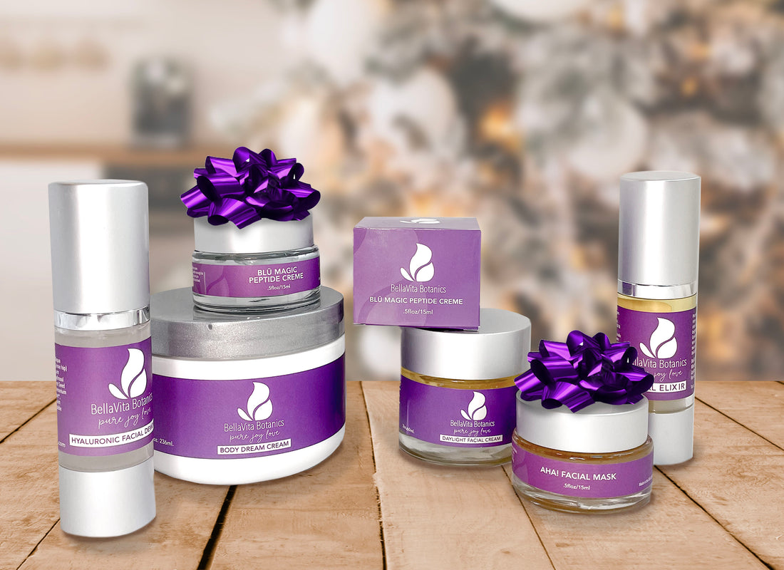 Body and facial creams, elixirs and masks in glass containers with purple labels and silver lids on wooden table